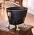 This antique coal scuttle with the original liner was created in England, circa 1870. Crafted from copper, the oblong...