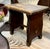 An old wood bench or stool made by hand in the early part of the 20th century. American. The wood surface has seen a lot...