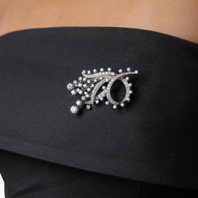 This exceptional French Mid Century brooch showcases a dazzling arrangement of diamonds, combining old European, round...