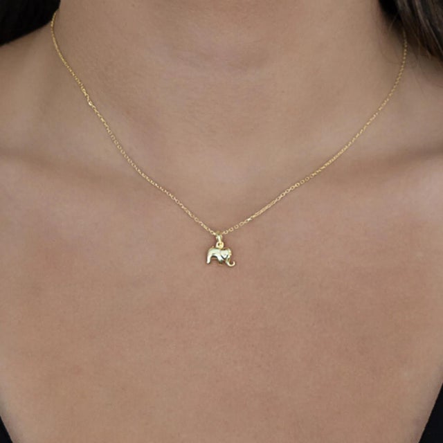 The Abundance Elephant Pendant Gold Chain Necklace is a captivating piece of jewelry that exudes grace and symbolism.The...