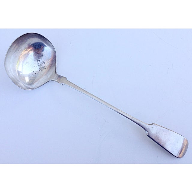 A classic, English pattern with hallmarks on the back of the handle. Minimal wear at the base of the bowl.