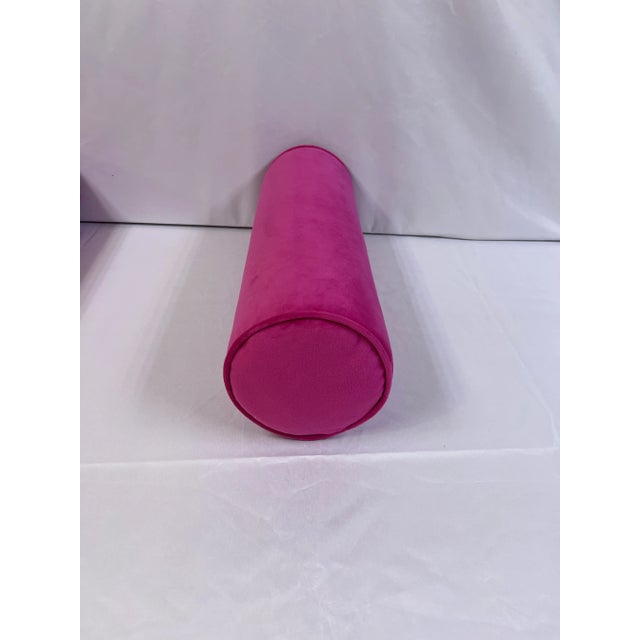 Custom made fuschia pink bolsters with matching piping edges. Invisible zippers for a clean finish