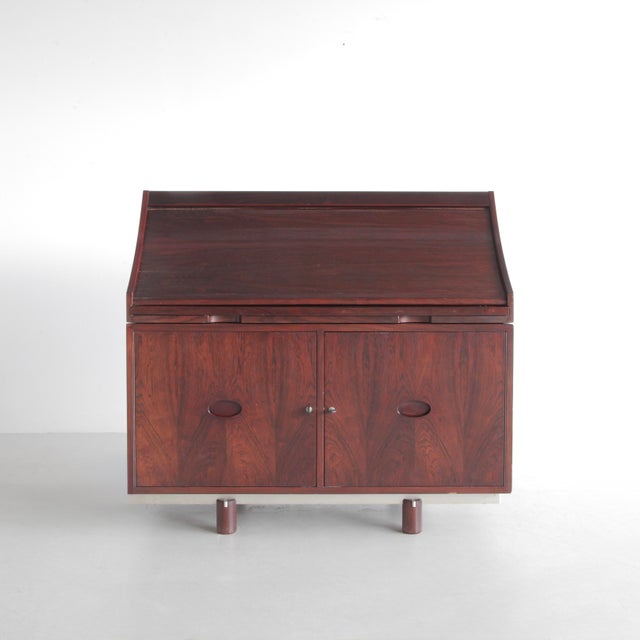 Elegant modular walnut Desk, mod. 807 with black leather and aluminium detail. The roll top tambour-door opens by pulling...