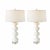 A sculptural pair of Global Views Stacked Bulb Table Lamps in a refined matte white finish. Designed with a rhythmic,...