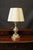 Pleated Lamp. A graceful lamp with a classic, linear style, crafted by Florentine artisans. The entirely wooden pedestal...