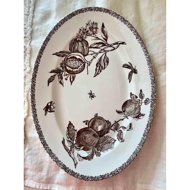 A rare and highly collectible antique set of fine terre de fer ceramic, produced by the historic french manufacturer...