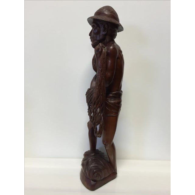 Hand carved solid rosewood Asian fisherman statue. Beautiful artistry and craftsmanship. Unsigned, artist unknown. Origin...
