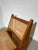 Beautiful vintage low lounge chair featuring a striking architectural design with solid wood construction and handwoven...