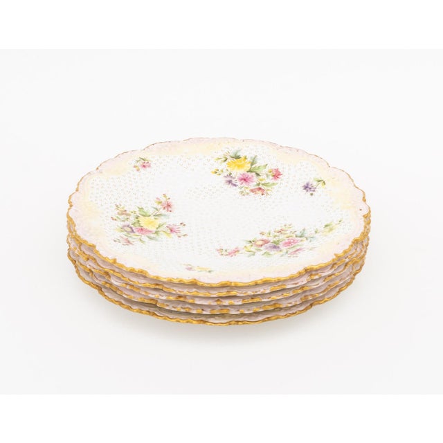 Set of Five Copeland Spode for Tiffany and Company Porcelain Plates, each with floral motif, blushed rim and gilt edges,...