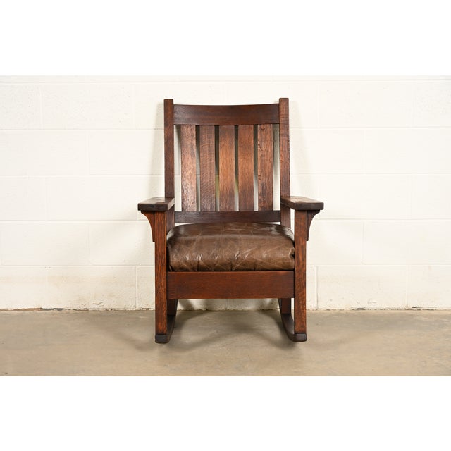 A gorgeous antique Mission or Arts & Crafts period quarter sawn oak rocking chair By Gustav Stickley USA, Circa 1910...