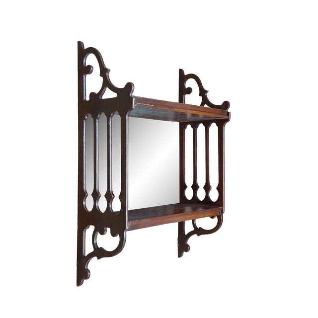 Vintage mid 20th century Chinese Chippendale style mahogany 2 tier wall hanging shelf featuring scrolled fretwork sides...
