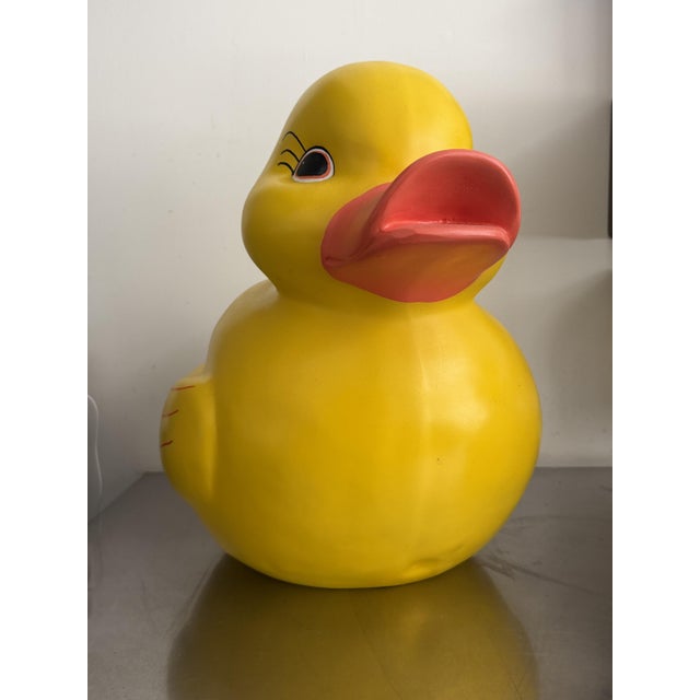 An oversized sculptural take on the classic yellow bath duck — hand-painted molded fiberglass or resin, standing roughly...