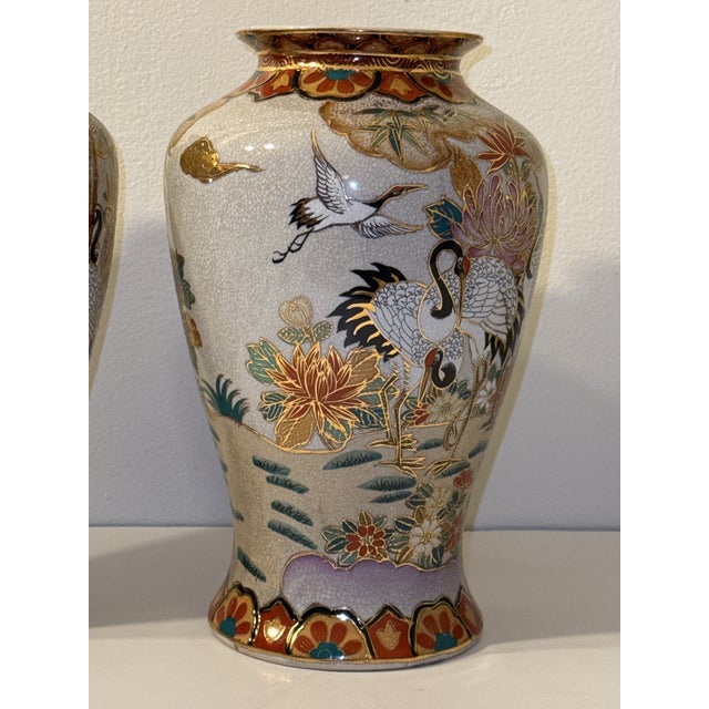 Pair of Chinese Raised Enamel Crane & Lotus Vases (10.5") Beautiful pair of Chinese raised‑enamel vases, each decorated...