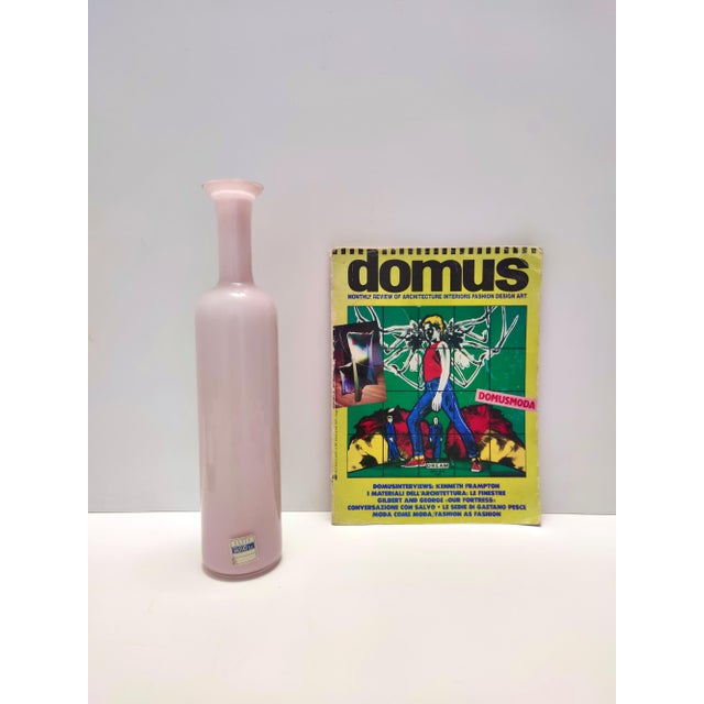 Made in Italy, 1970s. This wonderful vase / bottle is made in pink encased Murano glass with gold leaf. It is a vintage...