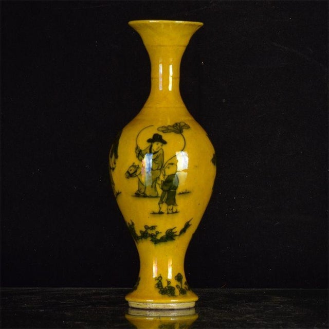 Distinctive Chinese porcelain olive-shaped vase finished in a rich golden yellow glaze, decorated with hand-painted dark...