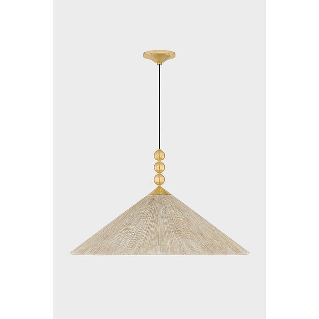 Opposites attract in the characterful Song. A light jute shade pairs with decorative Aged Brass spheres to create a...