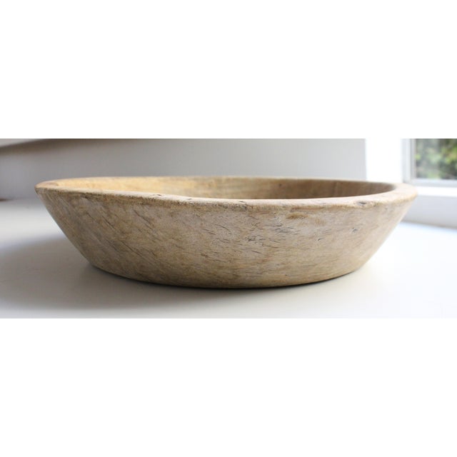 Antique distressed shallow dough bowl. We love it's organic shape. Entirely hand-carved from a solid piece of hardwood....