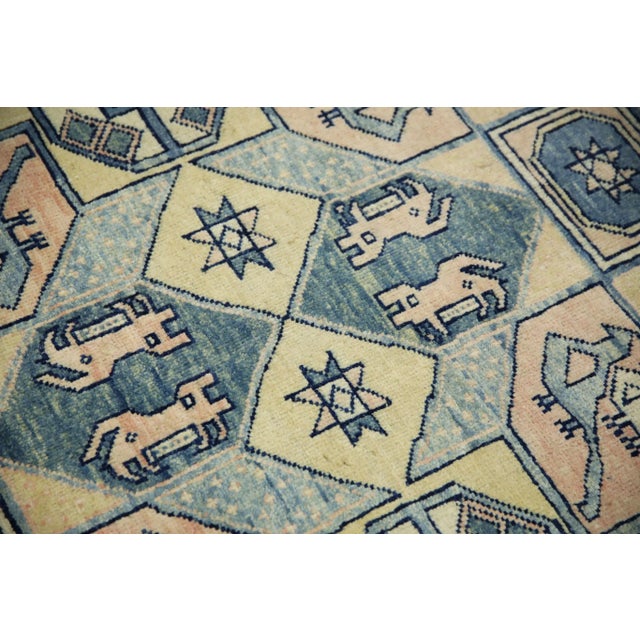 Introducing a one-of-a-kind vintage Turkish hand-knotted wool rug, carefully crafted by skilled artisans using traditional...