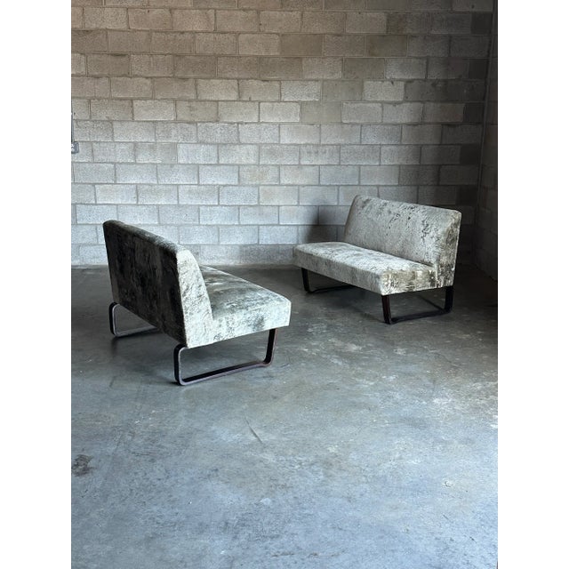 Rare pair of settees designed by Edward Wormley for Dunbar Furniture. Settees feature an armless profile complete with two...