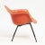 A fabulous Charles & Ray Eames transitional armchair produced by Herman Miller with Zenith Plastics. The salmon colored...