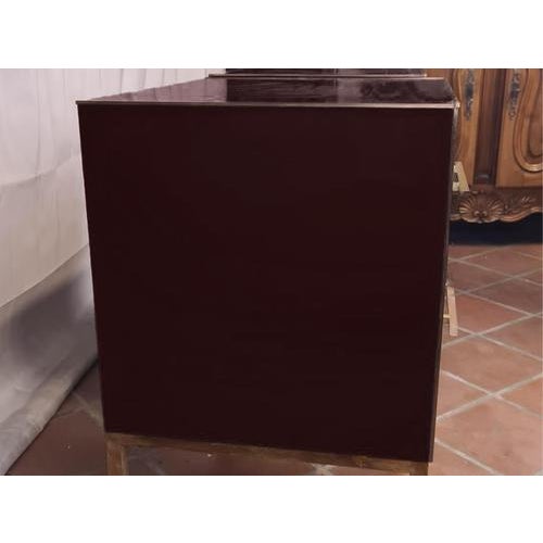 This pair of dark red mirrored glass nightstands embodies the elegance of 1950s design with a contemporary twist. Made of...