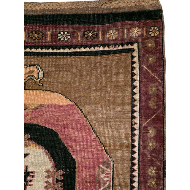 This mid-20th-century Turkish Anatolian long gallery carpet presents four large, vertically aligned medallions across a...