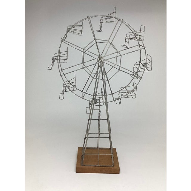 Folk Art Wire Ferris Wheel Handmade Sculpture on Wood Base. This piece does move. I do have a video that cherish has no...