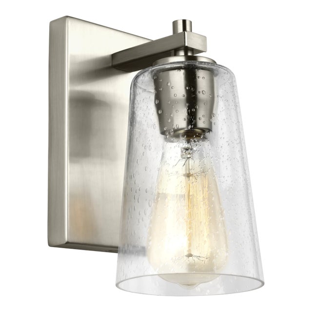 The Sean Lavin Mercer one light wall sconce in satin nickel offers shadow-free lighting in your powder room, spa, or...