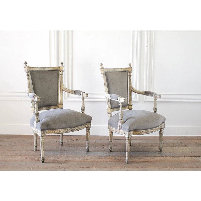 19th Century Pair of Painted and Upholstered Open Arm Fauteuils in the Louis XVI Style. Beautiful original painted finish...