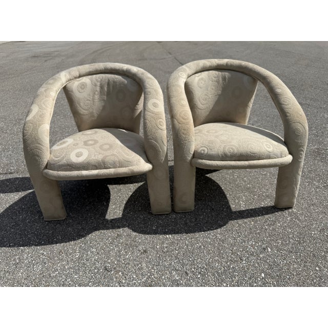 A matching pair of lounge chairs circa 1980's. These well built chairs feature amazing design lines and their original...