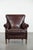 This luxurious armchair is crafted from sheepskin and boasts a beautiful, warm, dark color. It features a loose seat...