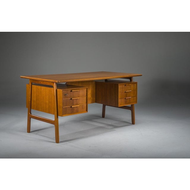 Exceptional Model 75 teak desk by Omann Jun Møbelfabrik, Denmark, 1960s. Professionally restored in our workshop and...