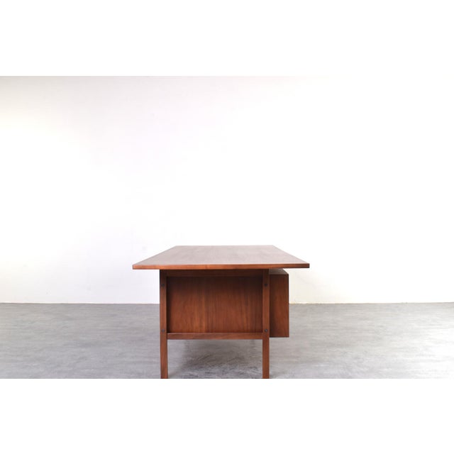 A large Danish desk made in the 1970s. This model stands out for its impressive dimensions. Measuring 218 cm wide and 100...