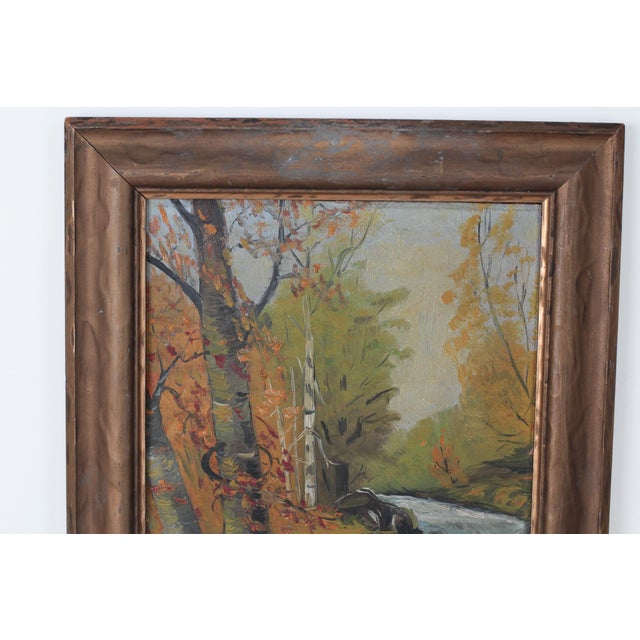 A beautiful, original mid-century oil painting on board by artist Kenneth Askin. This landscape captures an autumn river...