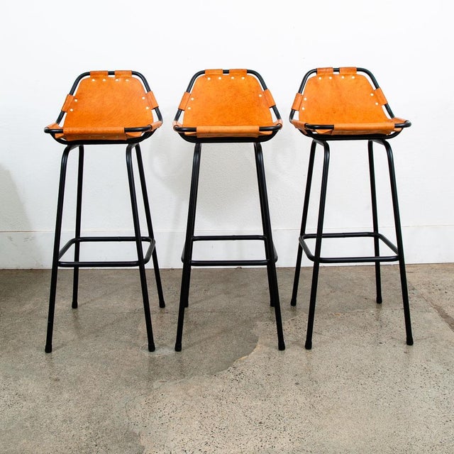 Set of 3 tubular metal bar stools with leather seats by Charlotte Perriand for Les Arcs C1960s . The heavy duty and thick...