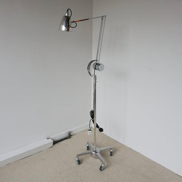 An art deco counterpoise trolley lamp by hadrill & horstmann. Set on a four-legged weighted base with circular fork and...
