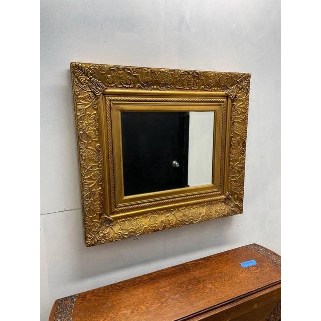 For sale is a beautiful vintage Solid wood mirror, finished in gold leaf. The frame is thick and solid with a floral style...