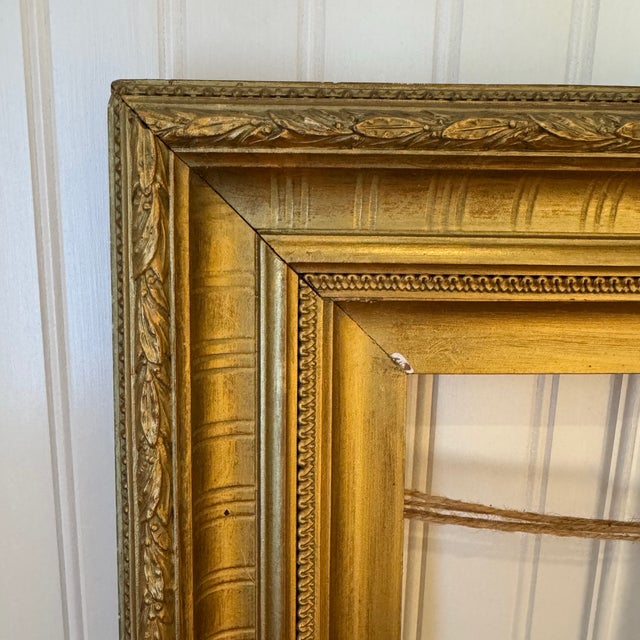 Elevate your artwork, mirror, or gallery wall with this gorgeous antique gold-gilt wooden picture frame. Featuring a deep...