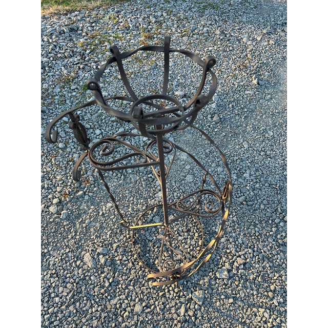 Metal Spiral Plant Stand in a Brown Color with Four Shelf’s along with a Top Plant Holder .