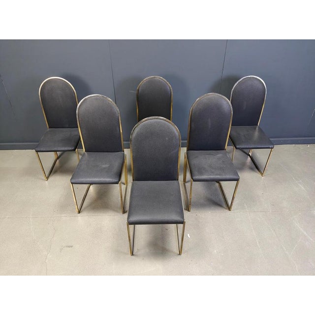Set of six elegant dining room chairs manufactured by Belgochrom. The chairs consist of fine brass frames upholstered with...