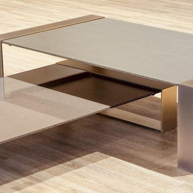 A striking contemporary coffee table designed by mauro lipparini for orsenigo in italy , showcasing a refined combination...