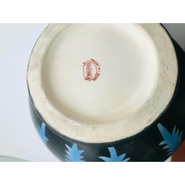 We love the shape and bold colors of this pitcher. Marked on the bottom.