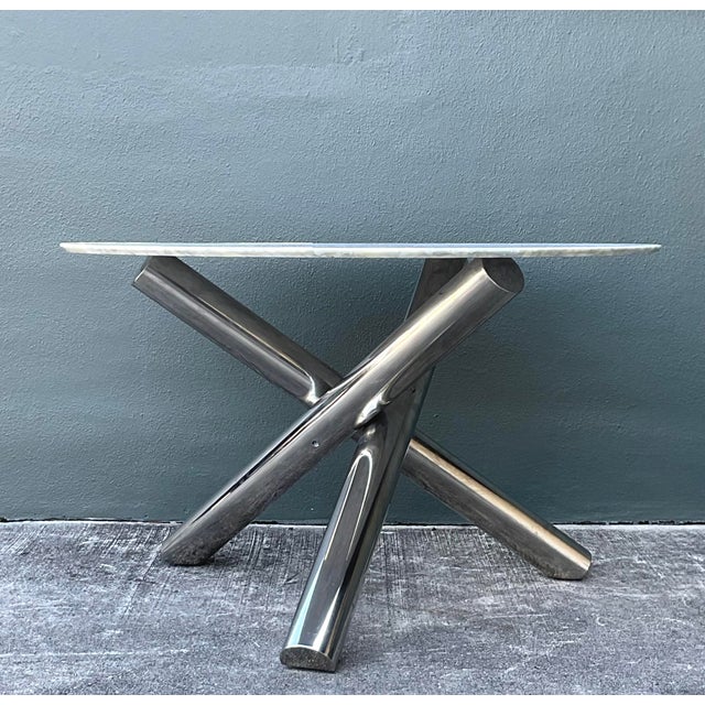 This exceptional vintage dining table, crafted in the prestigious Italian modernist tradition, is a tour de force of late...