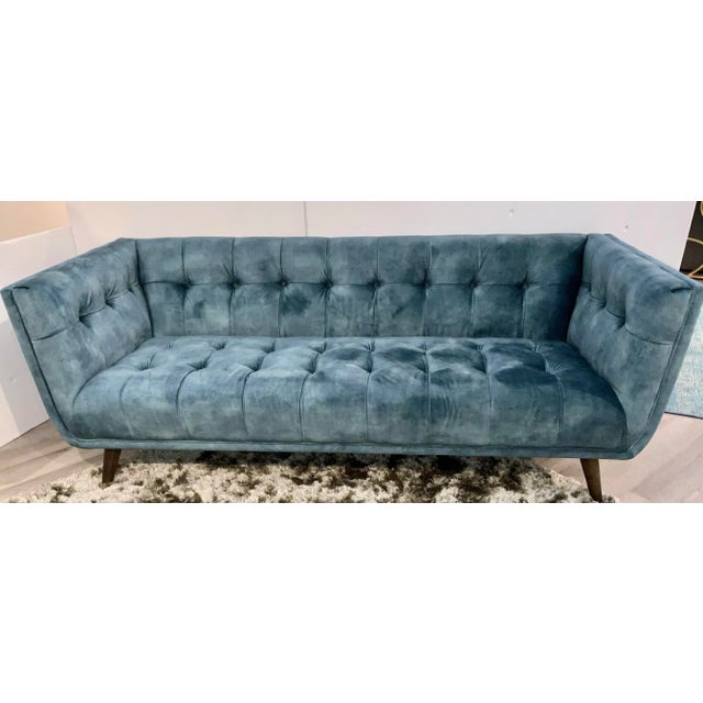Stylish Modern Tufted Turquoise Tufted Velvet Sofa, warm dark walnut finished tapered feet, showroom floor sample