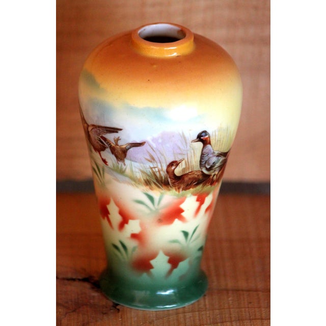 This is an Edwardian Era art nouveau style German porcelain vase with leaves and pheasants. The vase has no chips or...