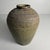 A large Japanese storage jar (kame/tsubo) in stoneware, with a calm, powerful silhouette and a beautifully organic...