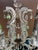Early 20th century crystal chandelier with 6 arms and one lamp in center.