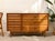 A handsome vintage mid-century dresser with a wonderfully asymmetrical layout and warm walnut finish. The left side...