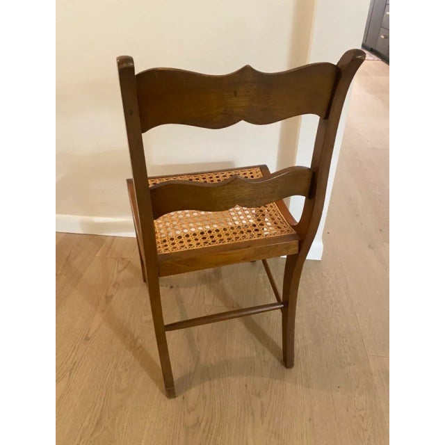 Wood and caned seat occasional chair with curved back and seat front. In great condition.