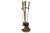 A set of metal fireplace tools with stand. Includes tongs, poker, shovel and brush, each with a contoured beveled handle...